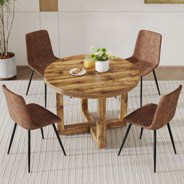A Modern And Practical Circular Dining Table. Made Of MDF Tabletop And Wooden MDF Table Legs. A (Set of 4) Brown Cushioned Chairs In A Modern Medieval Style Restaurant